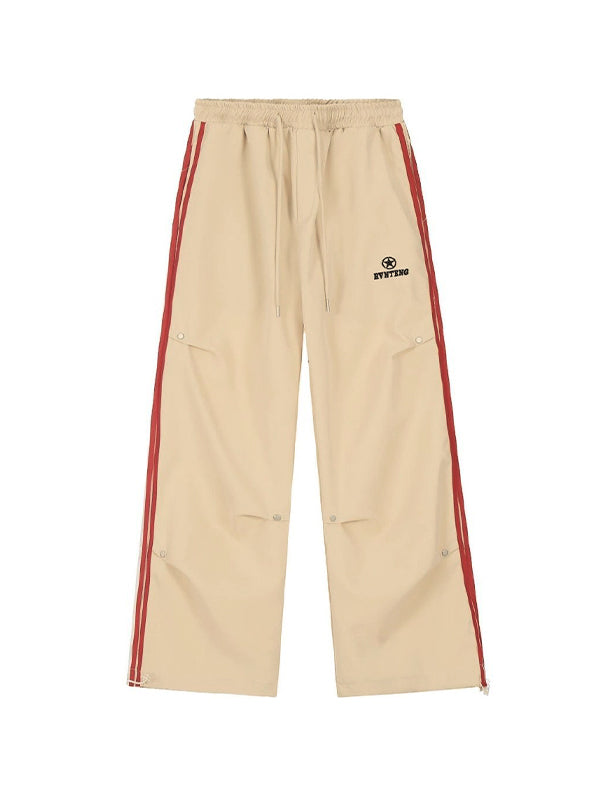 BEIGE CARGO PANTS WITH RED STRIPE AND PLEATED BUTTON DETAILS
