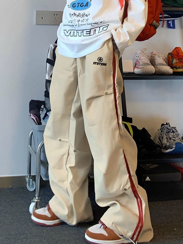 BEIGE CARGO PANTS WITH RED STRIPE AND PLEATED BUTTON DETAILS