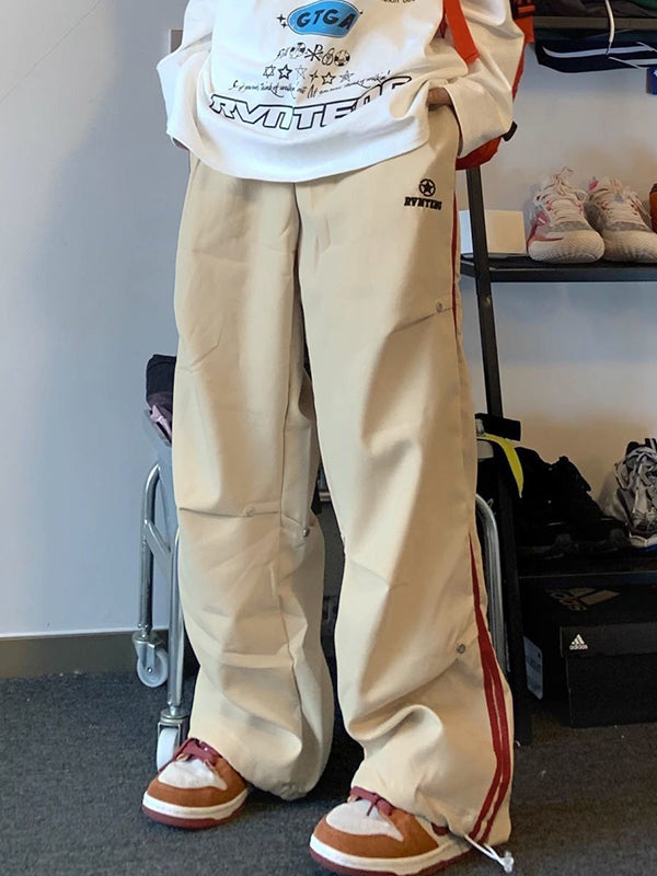 BEIGE CARGO PANTS WITH RED STRIPE AND PLEATED BUTTON DETAILS