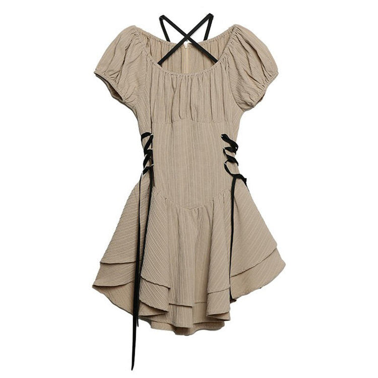 BEIGE MINI DRESS WITH BLACK LACE-UP SIDES AND CRISS-CROSS BACK STRAPS
