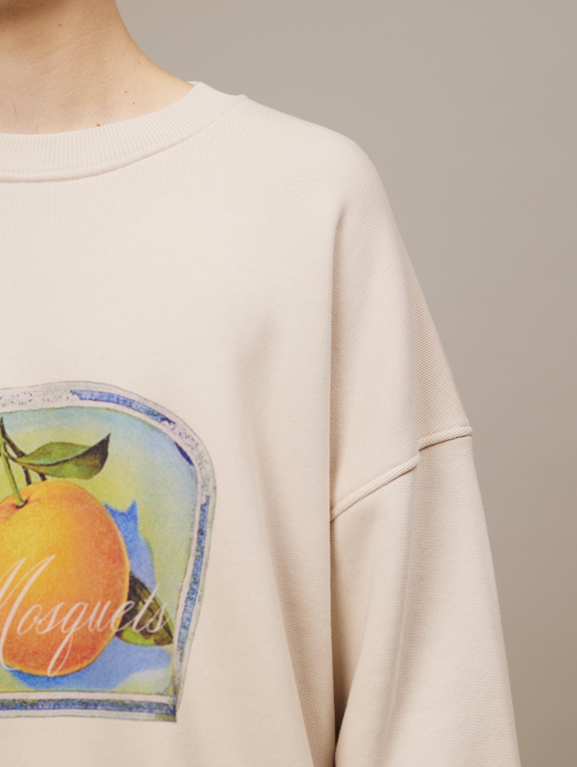 BEIGE OVERSIZED DROPPED COTTON LOOPBACK SWEATSHIRT WITH ORANGE GRAPHIC