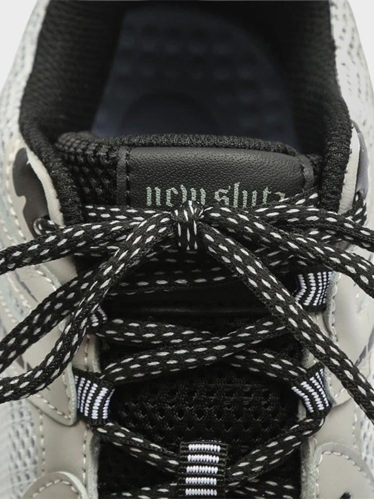 BLACK AND WHITE ATHLETIC SHOE FOOTWEAR