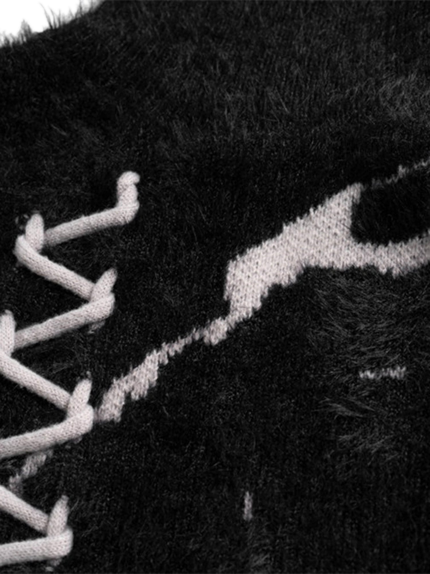 BLACK AND WHITE DISTRESSED KNIT SWEATER WITH LACE-UP DETAIL LONG SLEEVE