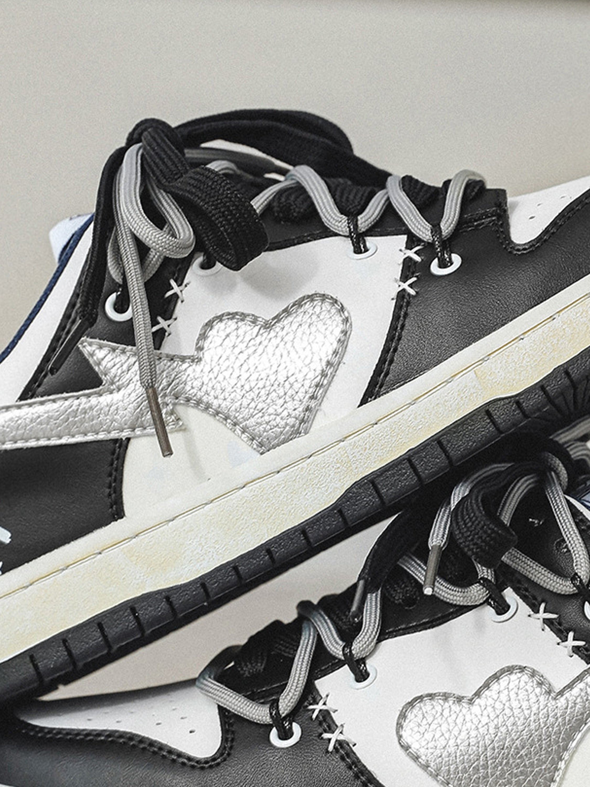 BLACK AND WHITE SNEAKERS WITH HEART DETAIL STREET LOVE PATCHWORK