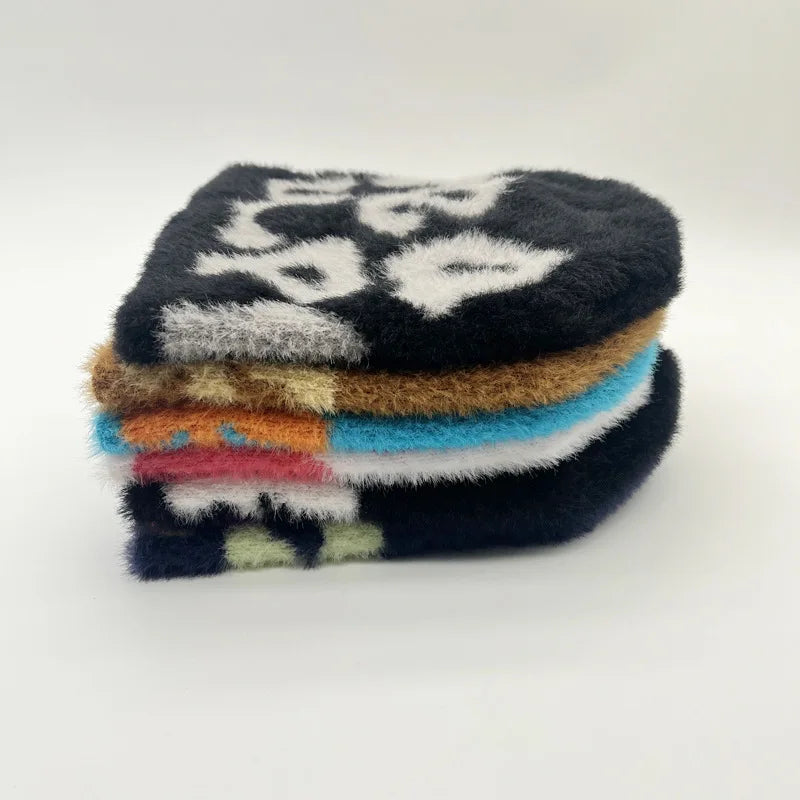 BLACK BEANIE WITH WHITE LETTERING - ROYAL BLUE SKY ACCENT