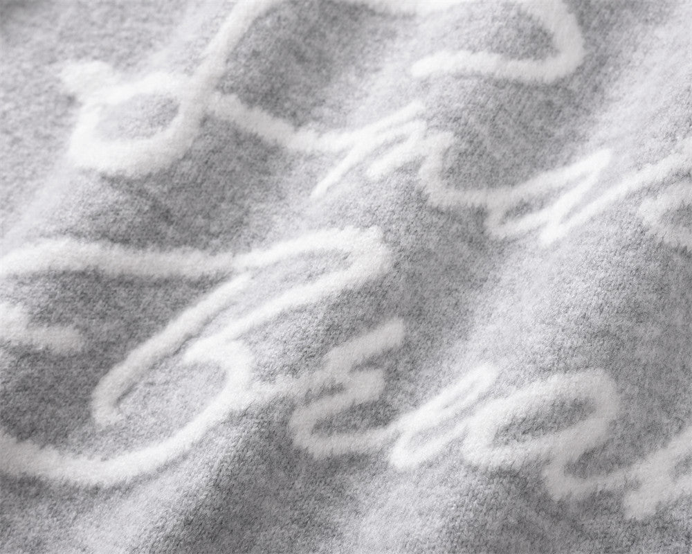 BLACK BREAK KNIT SWEATER WITH SMART BREAK TEXT