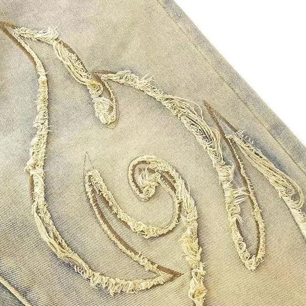 BLACK DENIM PANTS WITH FLAME CUTOUTS PENTALON MOTIF PANTS