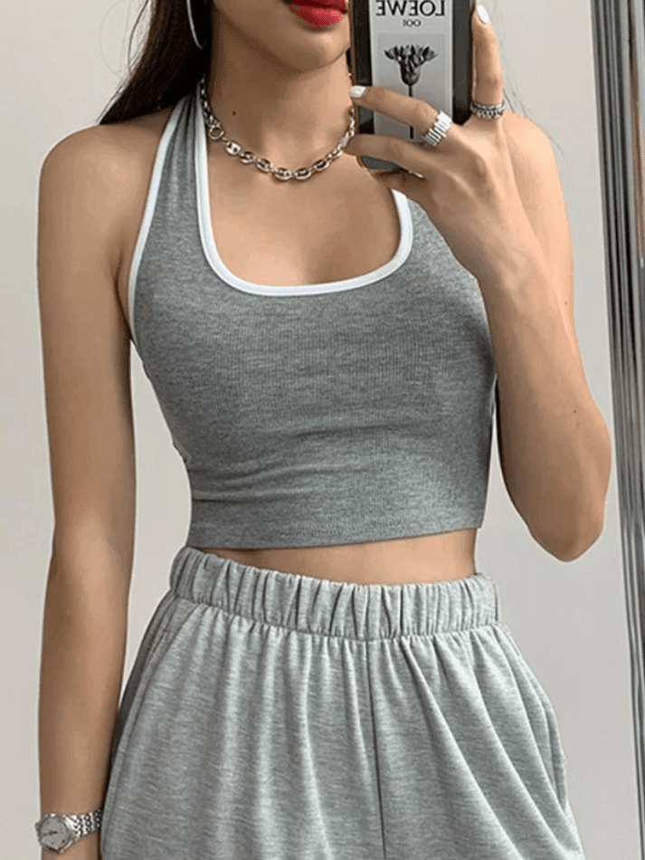 BLACK HALTER CROP TOP WITH CONTRAST COLOR PANEL - CHIC SPORTY STYLE