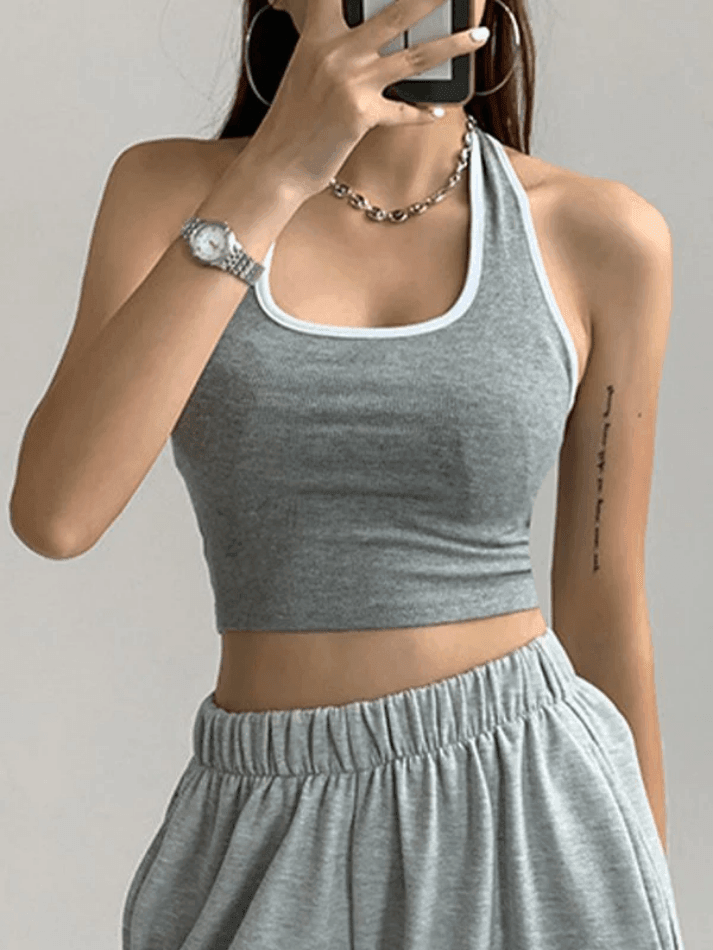 BLACK HALTER CROP TOP WITH CONTRAST COLOR PANEL - CHIC SPORTY STYLE