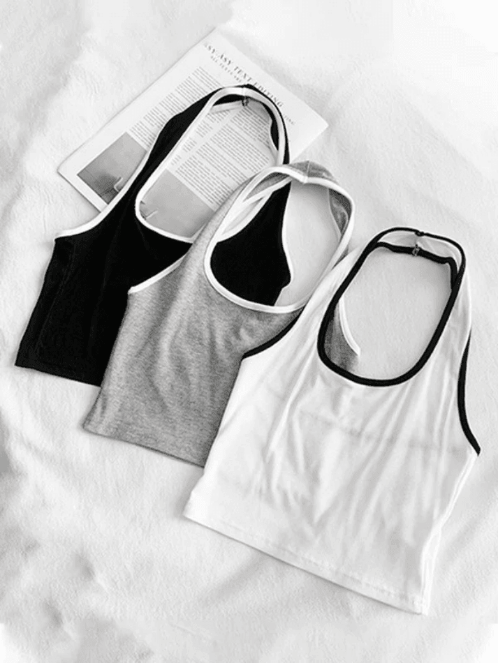 BLACK HALTER CROP TOP WITH CONTRAST COLOR PANEL - CHIC SPORTY STYLE