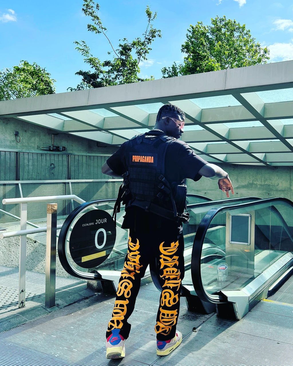 BLACK JEANS WITH ORANGE GOTHIC LETTERING FASHION STATEMENT APPAREL