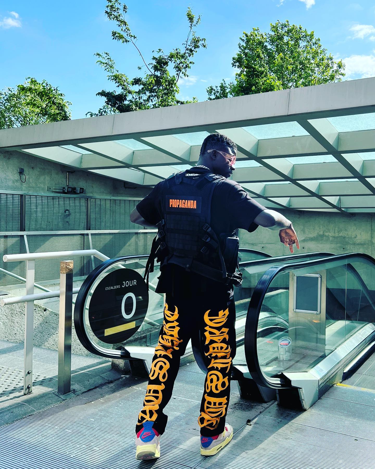 BLACK JEANS WITH ORANGE GOTHIC LETTERING FASHION STATEMENT APPAREL