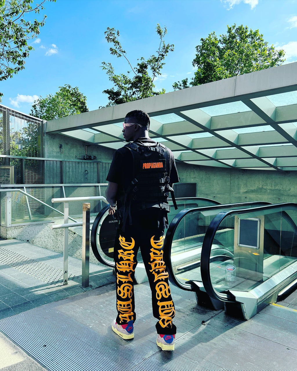 BLACK JEANS WITH ORANGE GOTHIC LETTERING FASHION STATEMENT APPAREL