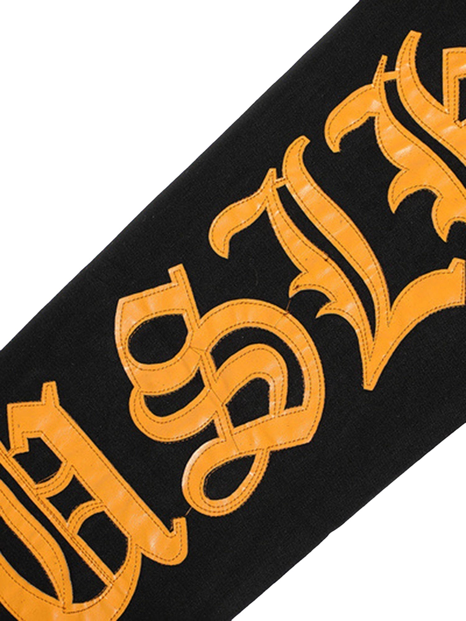 BLACK JEANS WITH ORANGE GOTHIC LETTERING FASHION STATEMENT APPAREL