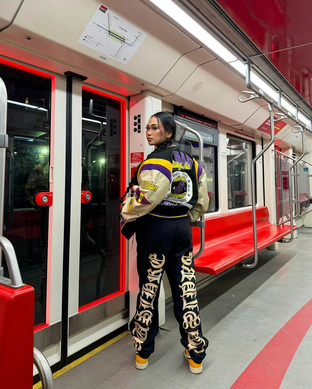 BLACK JEANS WITH ORANGE GOTHIC LETTERING FASHION STATEMENT APPAREL