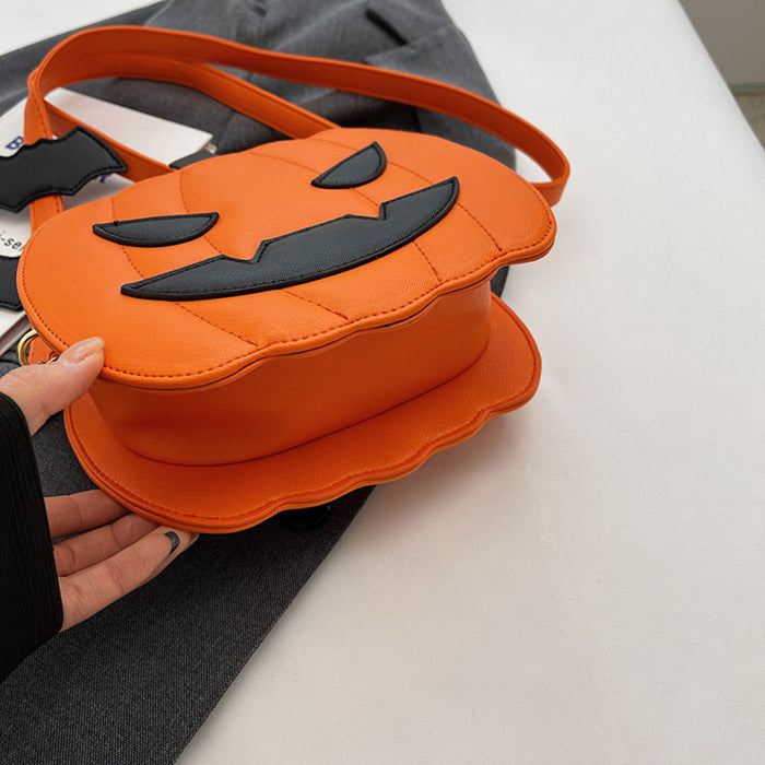 BLACK PUMPKIN-SHAPED PURSE WITH ORANGE ACCENTS FOR HALLOWEEN