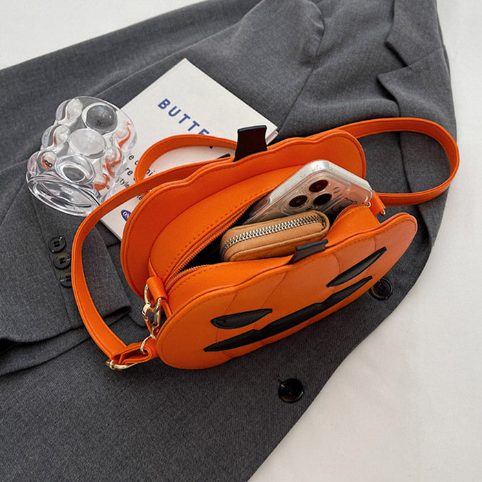 BLACK PUMPKIN-SHAPED PURSE WITH ORANGE ACCENTS FOR HALLOWEEN