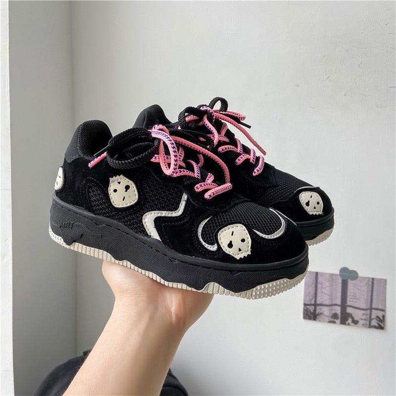 BLACK SNEAKERS WITH STRAWBERRY ACCENTS AND SUPERIOR TRACTION FIREBALL SHOES