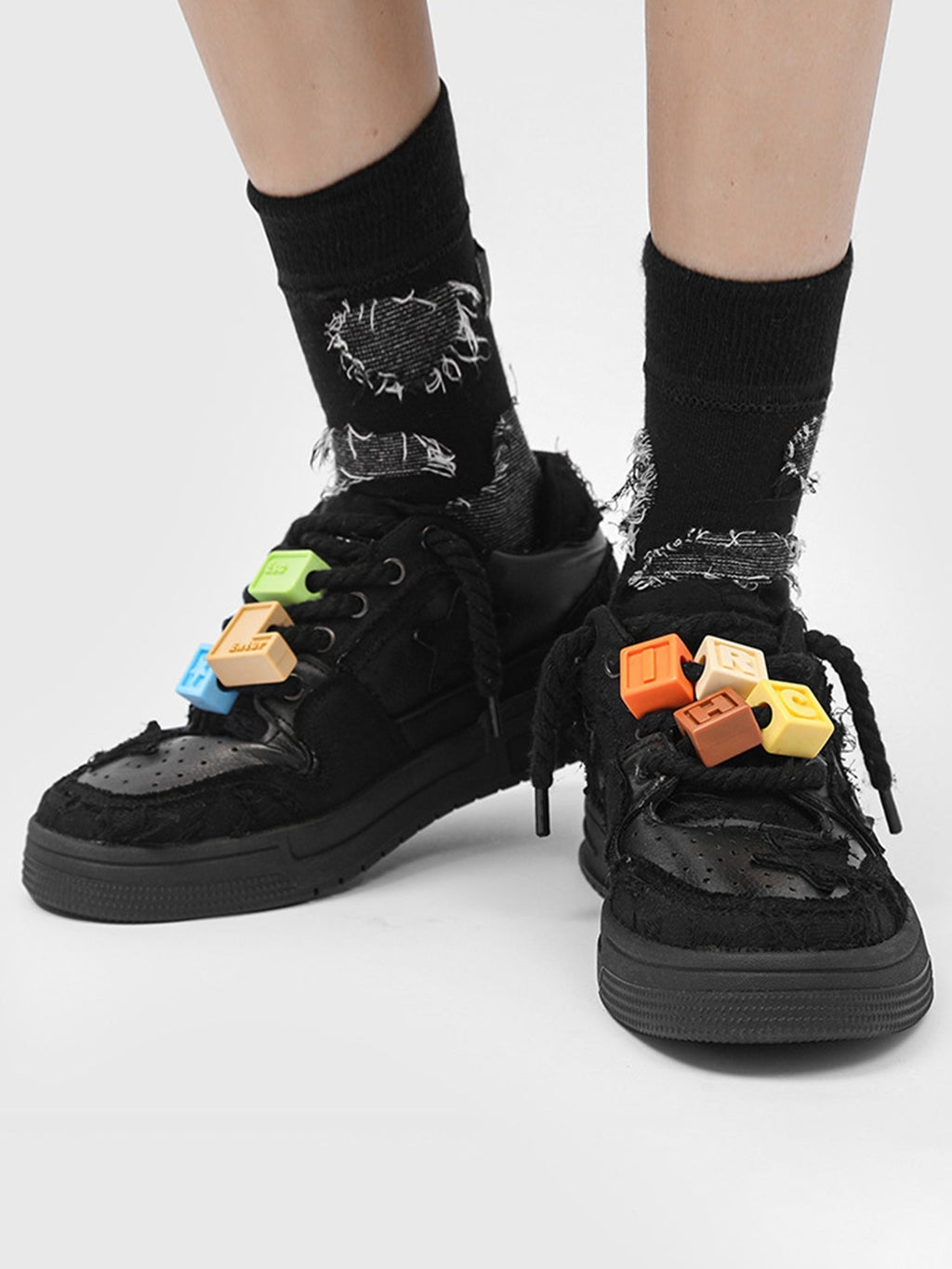 BLACK STAR-ACCENTED SNEAKERS FOR RETRO DARTH VADER ENTHUSIASTS