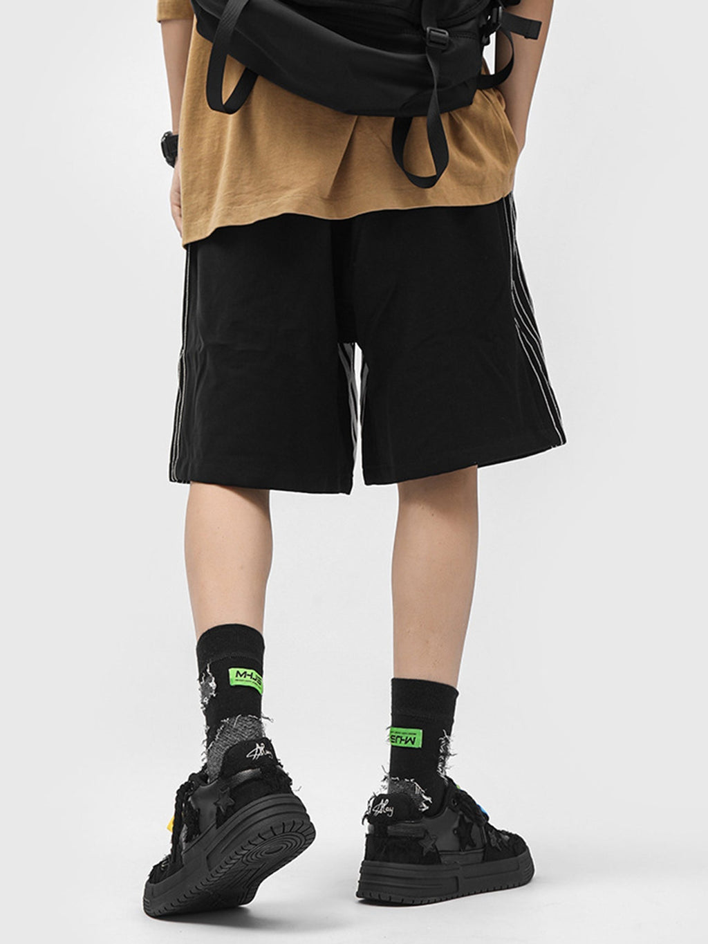 BLACK STAR-ACCENTED SNEAKERS FOR RETRO DARTH VADER ENTHUSIASTS