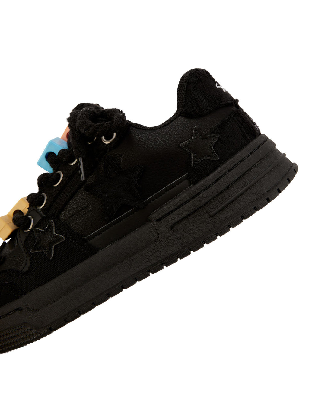 BLACK STAR-ACCENTED SNEAKERS FOR RETRO DARTH VADER ENTHUSIASTS