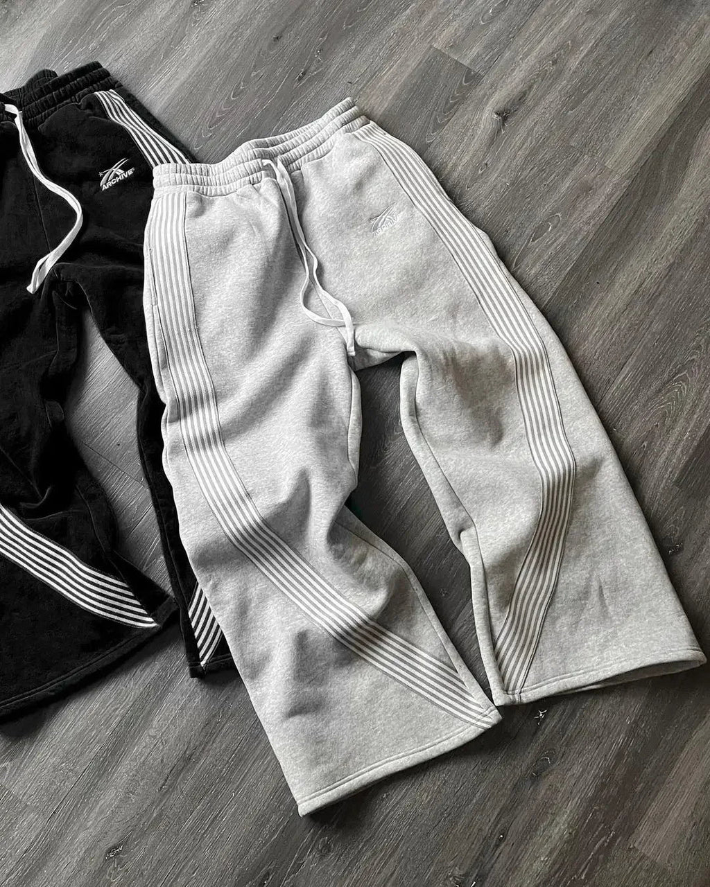 BLACK SWEATPANTS WITH WHITE STRIPES SECURE STORAGE SOLUTION