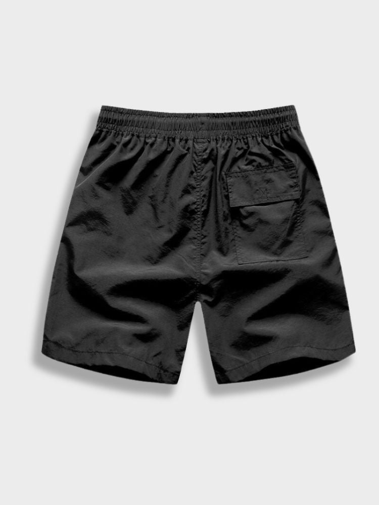 BLACK SWIM TRUNKS WITH ORANGE DRAWSTRING