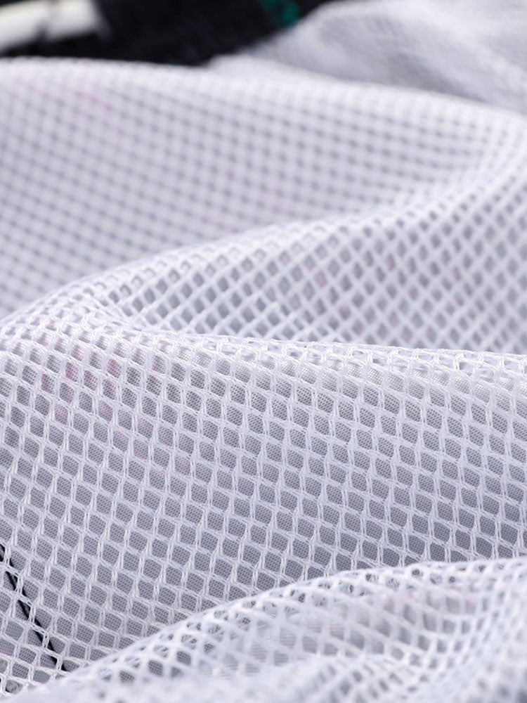 BLACK SWIM TRUNKS WITH TROPICAL PATTERN