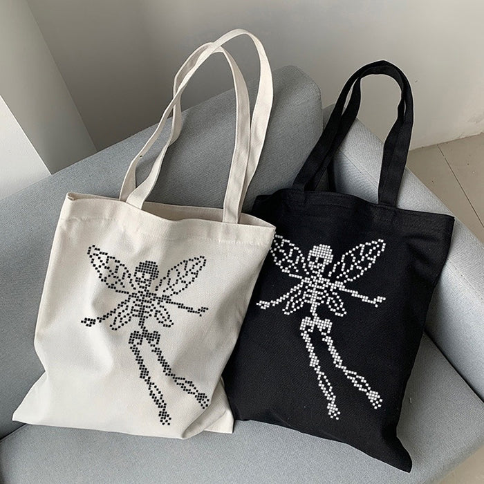 BLACK TOTE BAG WITH SKELETON FAIRY DESIGN FOR GOTHIC FASHION