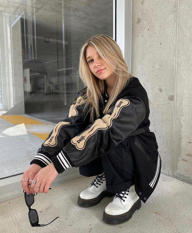 BLACK VARSITY JACKET WITH BONE SLEEVES CETTE VESTE EST CHIC