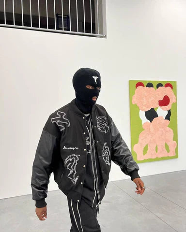 BLACK VARSITY JACKET WITH EMBROIDERED DESIGNS - SYMBOL EMBROIDERY