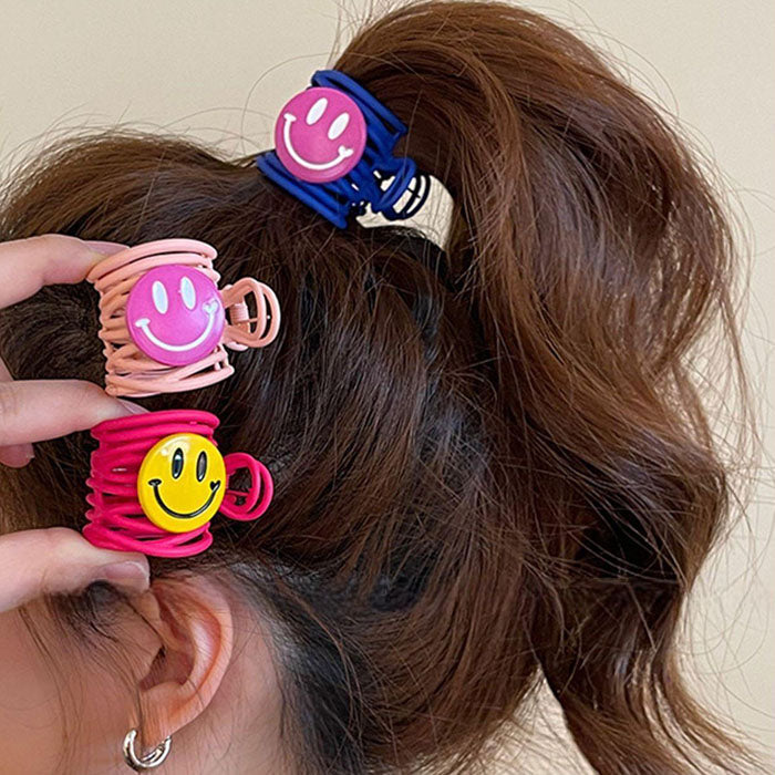 BLUE HAIR CLAW WITH PINK SMILE FACE HAIR ACCESSORY