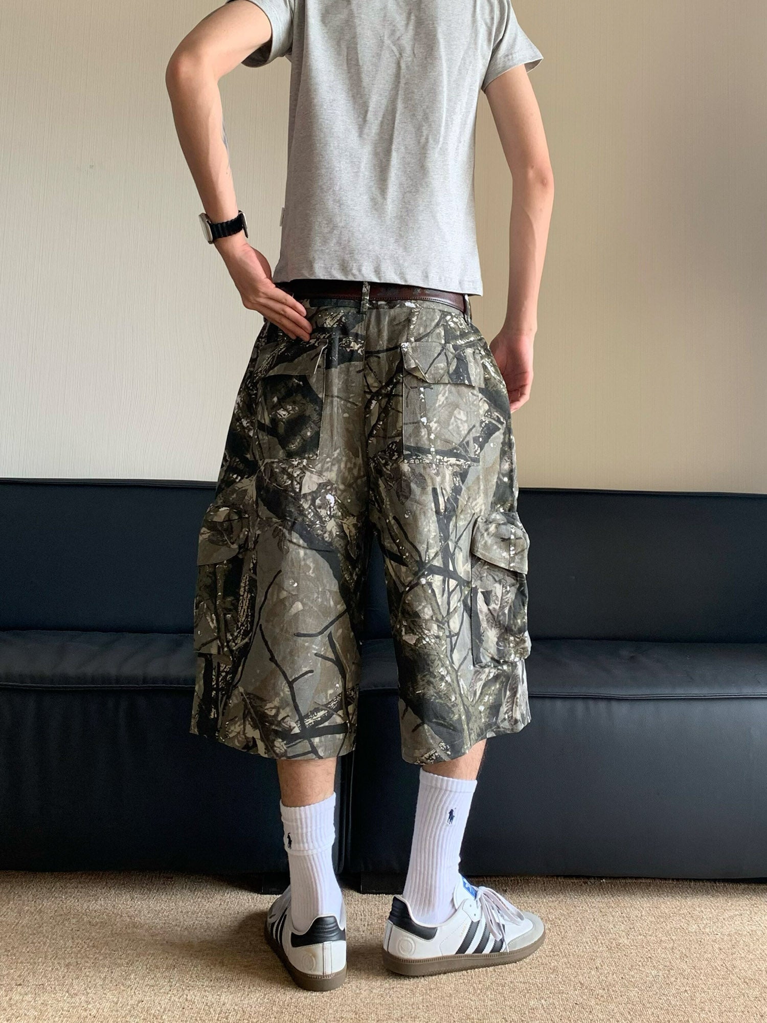 CAMOUFLAGE CARGO SHORTS WITH DESIGN ELEMENTS PRINT