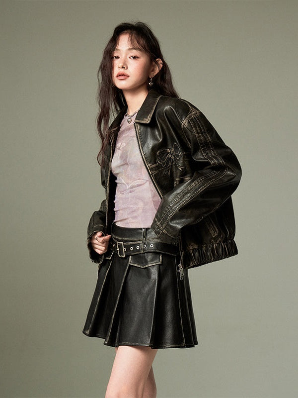 CHIC PLEATED MINI SKIRT IN BLACK FAUX LEATHER