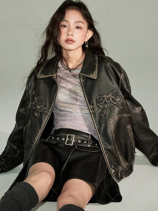 CHIC PLEATED MINI SKIRT IN BLACK FAUX LEATHER