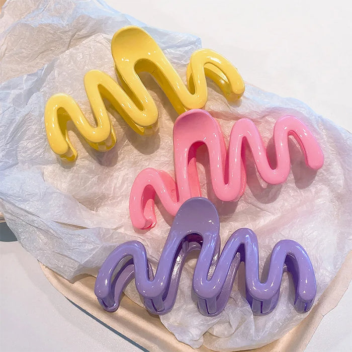 COLORFUL WAVE HAIR CLAW WITH GLOSSY PINK SQUIGGLE DESIGN