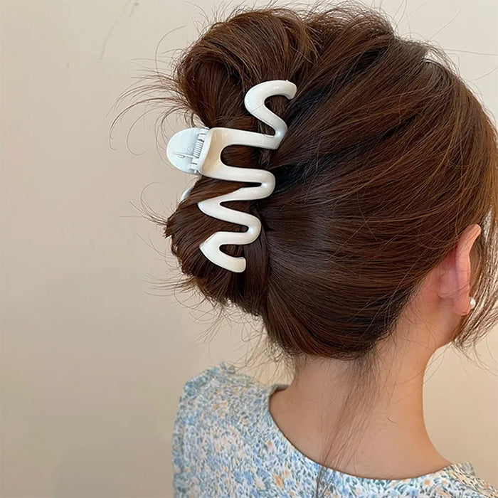 COLORFUL WAVE HAIR CLAW WITH GLOSSY PINK SQUIGGLE DESIGN