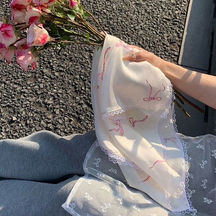 CREAM SILK SCARF WITH PINK BOW PATTERN AND LACE TRIM