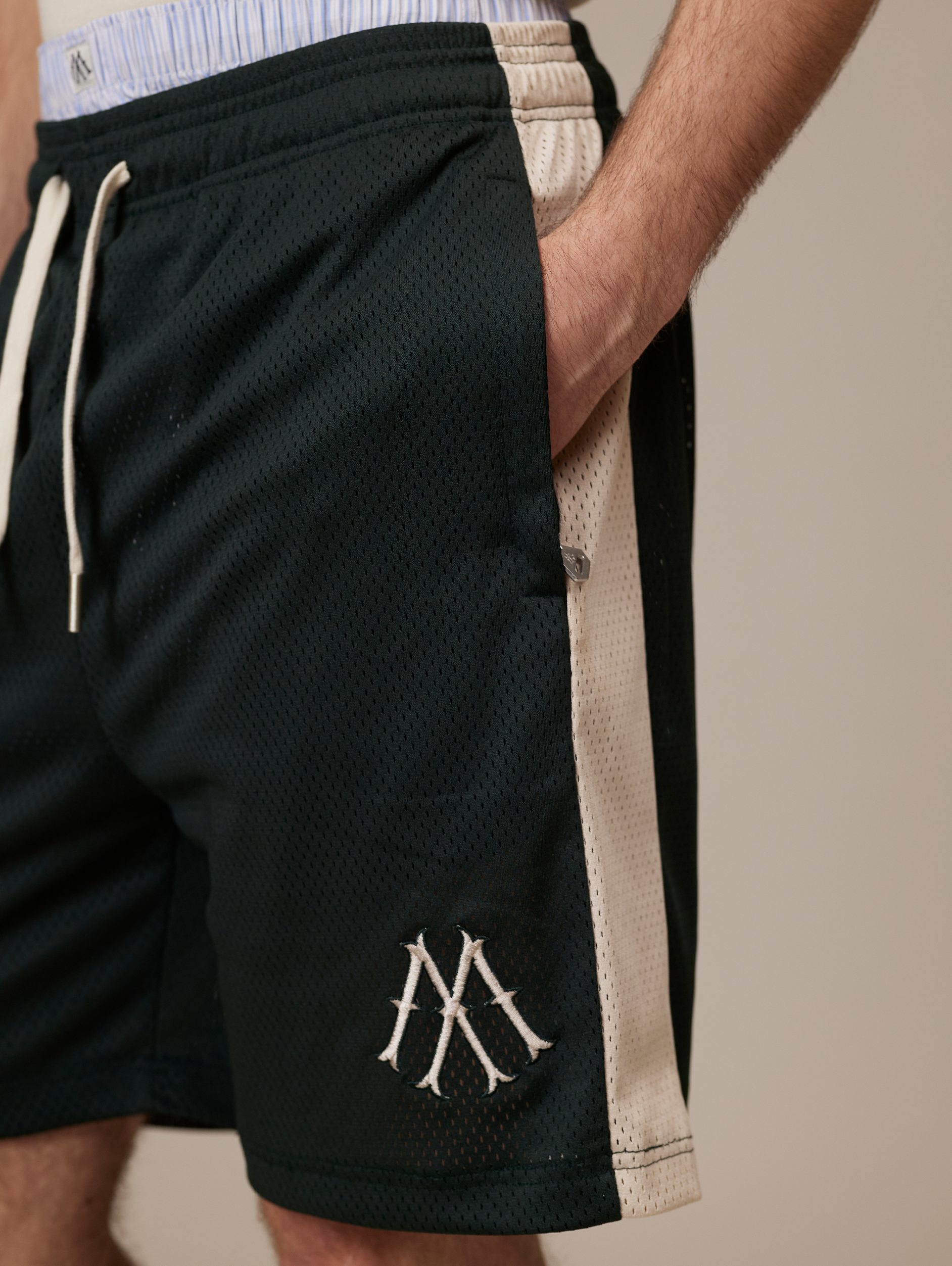 DARK GREEN ATHLETIC SHORTS WITH CREAM STRIPE FOR LUXURY STREETWEAR