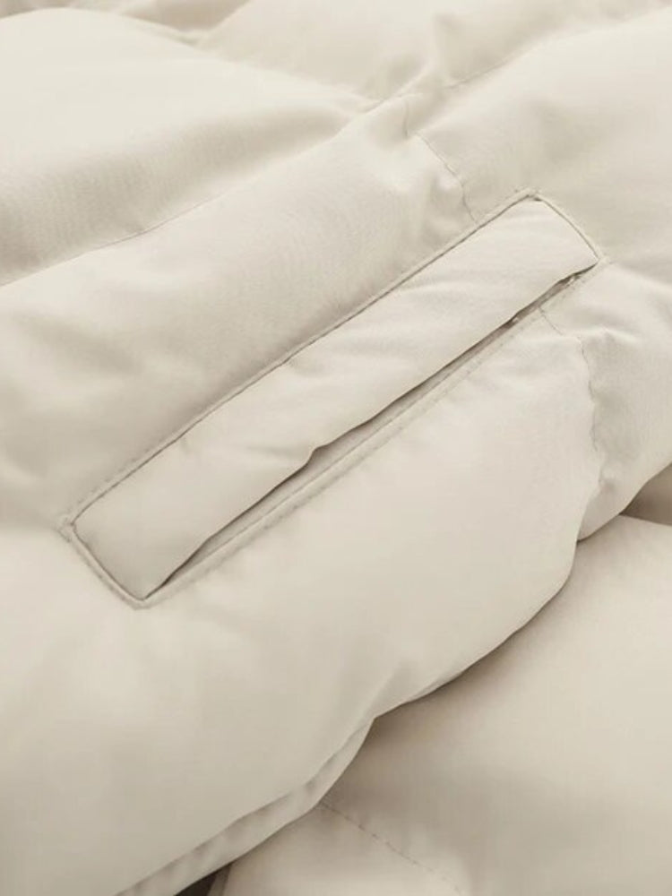 BLACK PUFFER JACKET WITH WHITE ACCENTS FOR COLD WEATHER WEAR