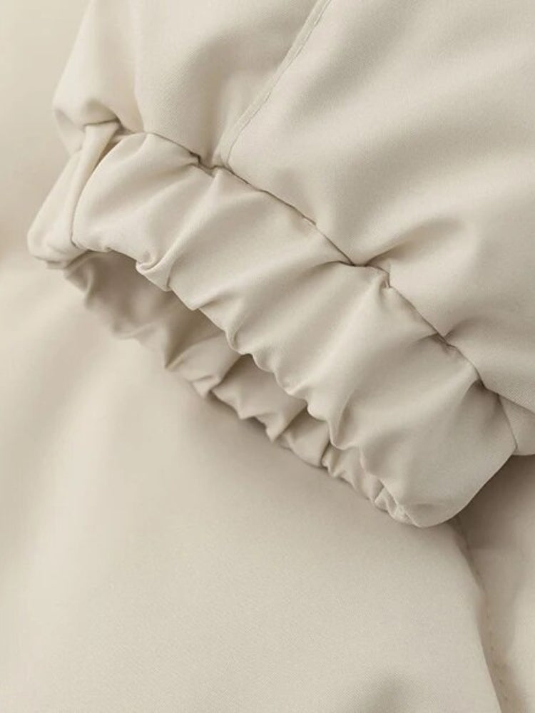 BLACK PUFFER JACKET WITH WHITE ACCENTS FOR COLD WEATHER WEAR