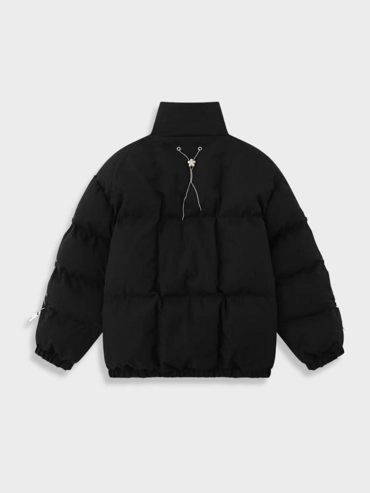 BLACK PUFFER JACKET WITH WHITE ACCENTS FOR COLD WEATHER WEAR