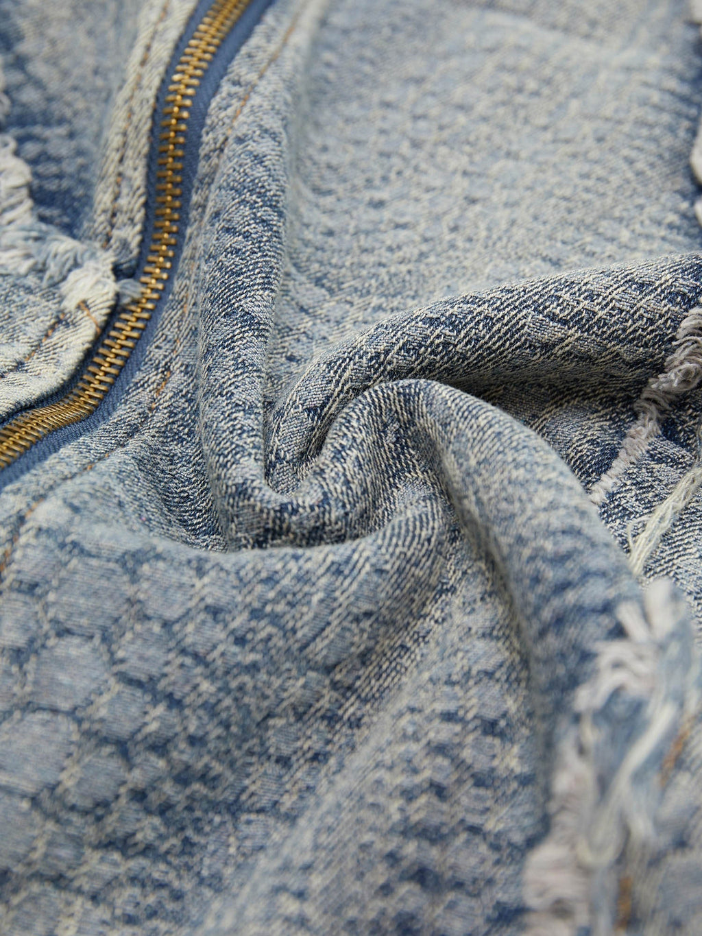 DISTRESSED DENIM ZIP-UP SHIRT WITH WASHED RAW EDGE DETAIL