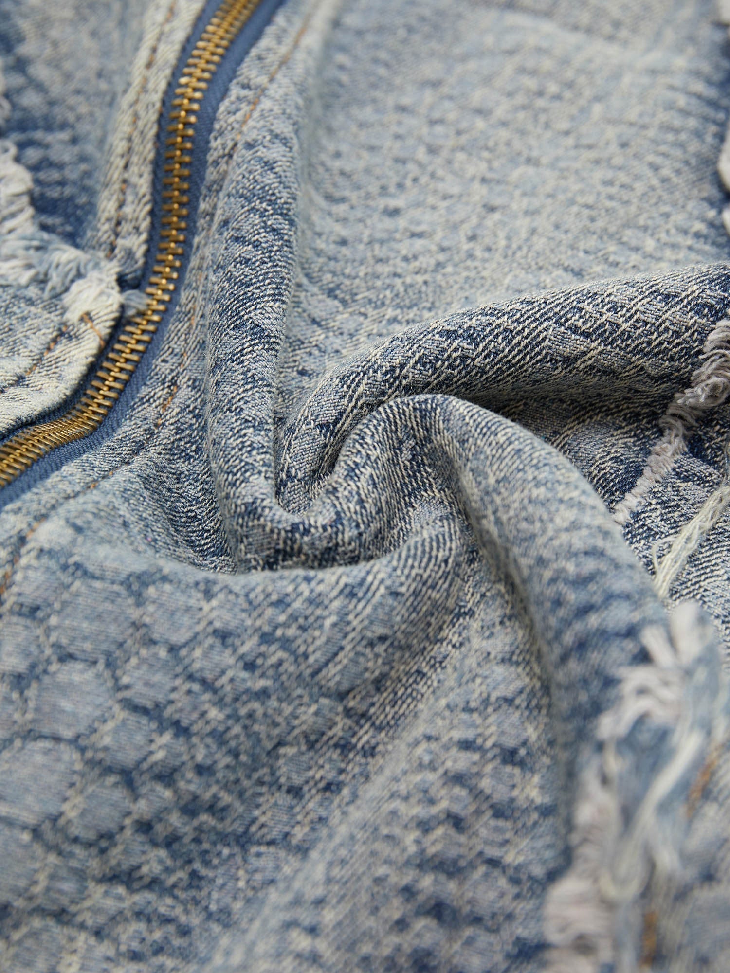 DISTRESSED DENIM ZIP-UP SHIRT WITH WASHED RAW EDGE DETAIL