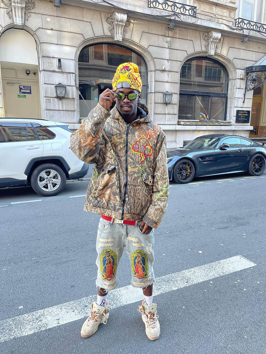 DISTRESSED GRAY JEANS WITH RELIGIOUS IMAGERY MID WAIST EMBROIDERED DETAIL