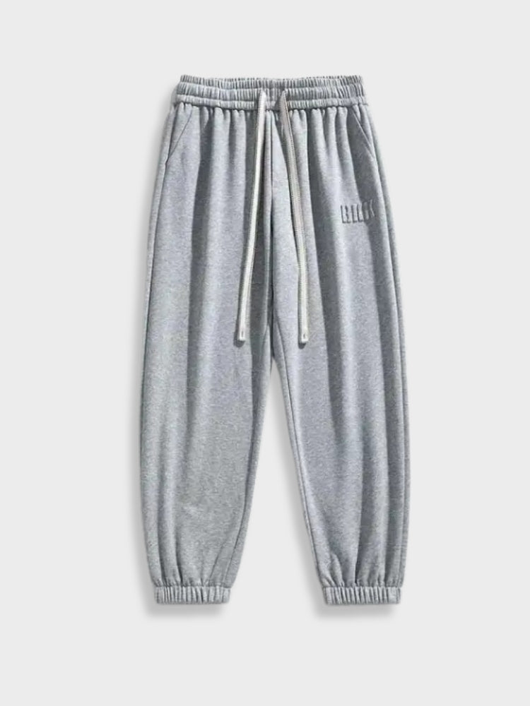 GRAY DRAWSTRING SWEATPANTS WITH ADJUSTABLE FIT AND DRAWSTRING HEM