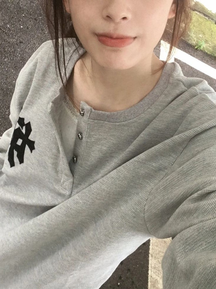 GRAY HOODIE AND JEANS OUTFIT WITH BOLD CROSS PRINT