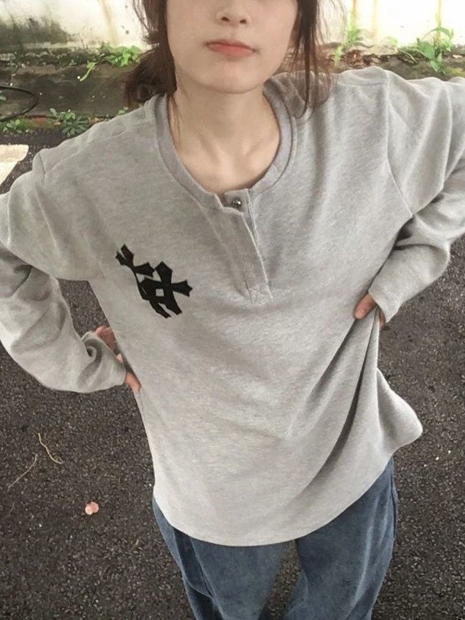 GRAY HOODIE AND JEANS OUTFIT WITH BOLD CROSS PRINT