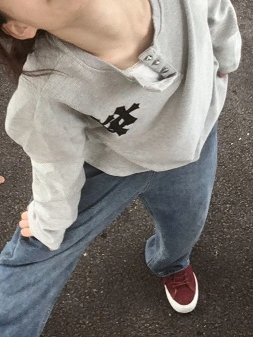 GRAY HOODIE AND JEANS OUTFIT WITH BOLD CROSS PRINT