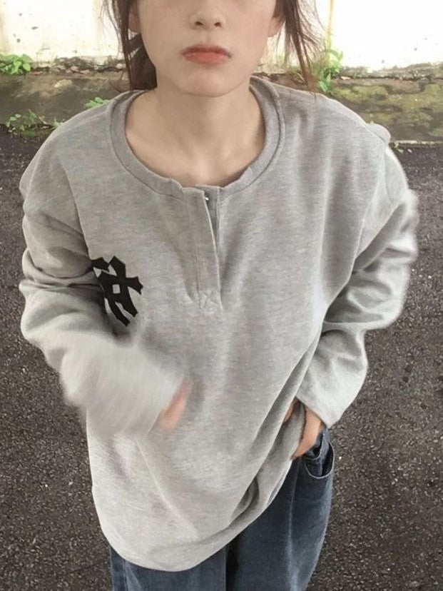 GRAY HOODIE AND JEANS OUTFIT WITH BOLD CROSS PRINT